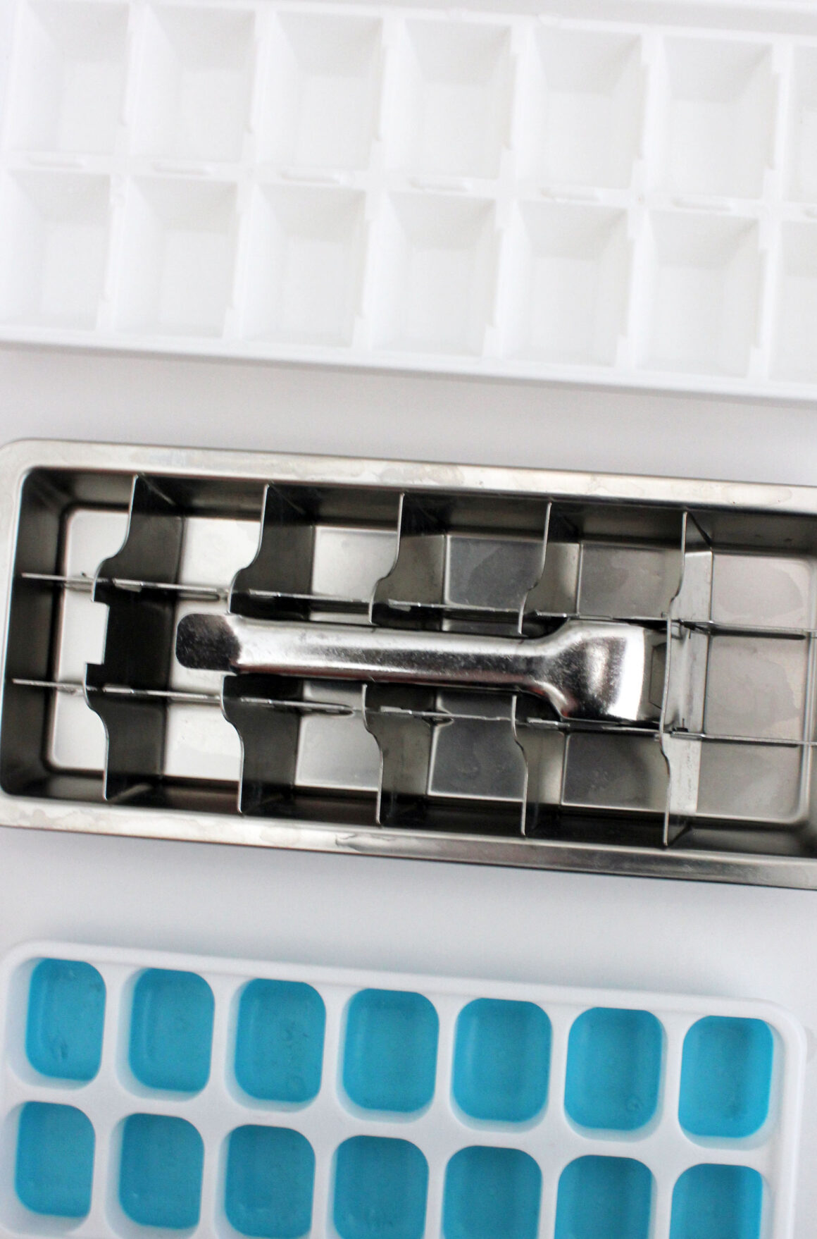 plastic, stainless steel and silicone ice cube trays